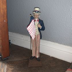 Uncle Sam figure figuring that at the bottom of the statue it says let freedom ring made by midwest perfect condition. No chips no cracks cool for Fou