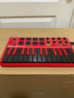 Akai Professional MPK Mini 25-Key MIDI Keyboard Controller With Imperfection. Missing the top part on the knob on the top left.. Used in good with som