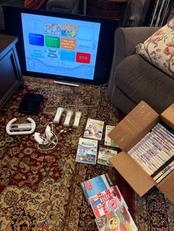 Nintendo Wii with games,controllers,cables