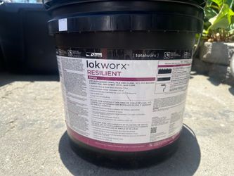 Professional- grade flooring adhesive