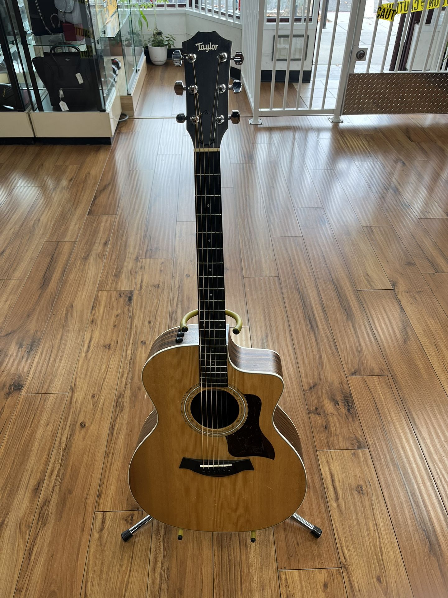 TAYLOR TAN ACOUSTIC GUITAR IN GOOD CONDITION WITH SOFT CASE