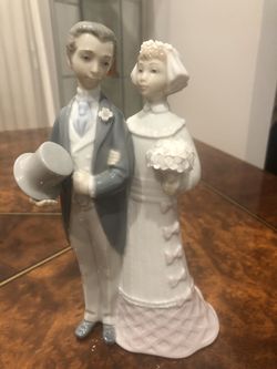 Retired Lladro bride and groom figurines