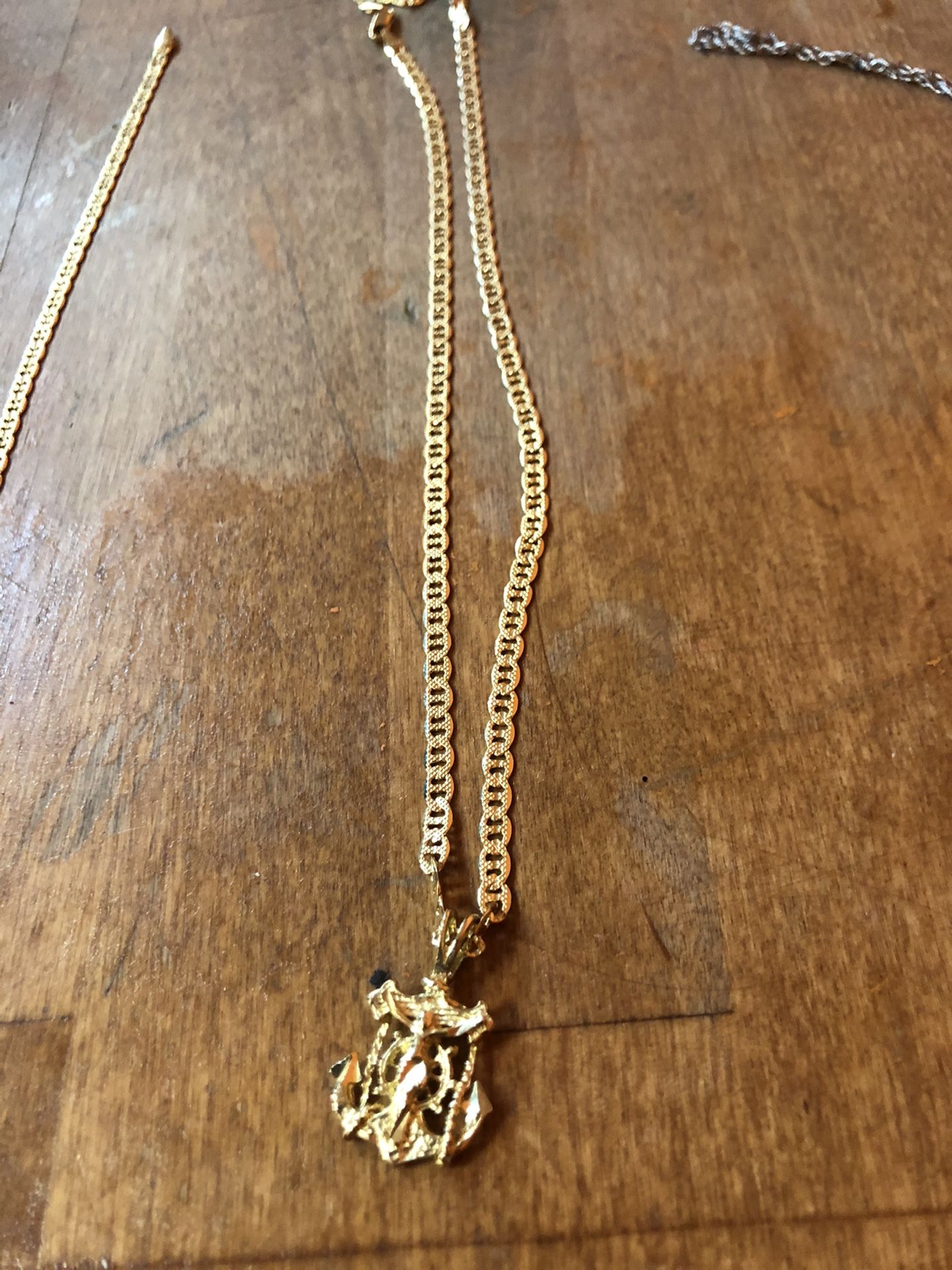 Yellow gold 20 inch 14k anchor and cross chain.