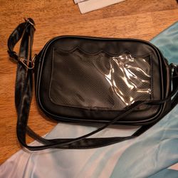 Black Cross Body Bag With Pin Display. 