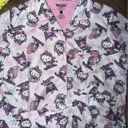 This item is a "Hello Kitty and Friends" long-sleeve pajama set featuring a winter or holiday-themed print of the characters skiing and surrounded by 