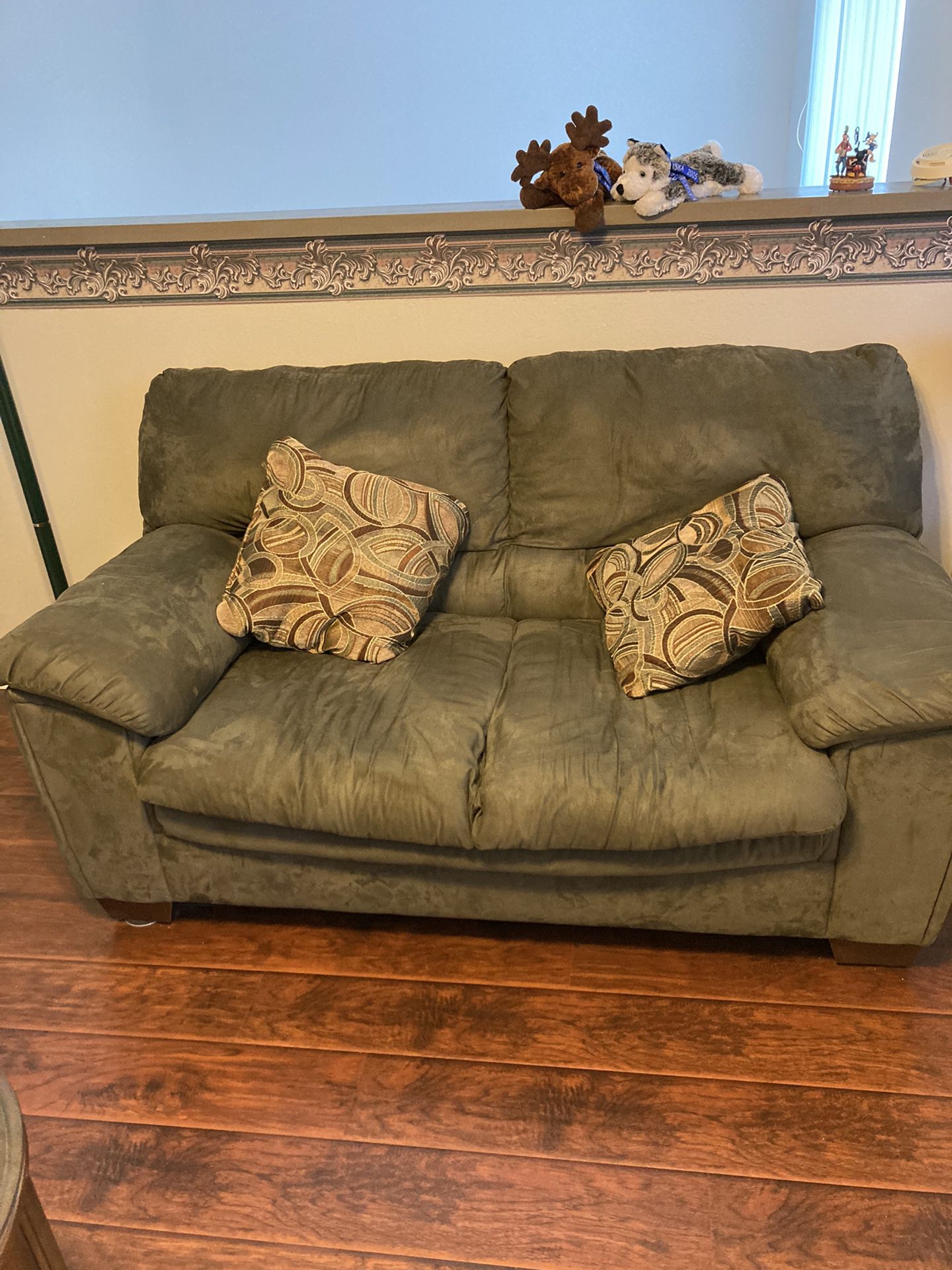 Used Love Seat With Two Pillows