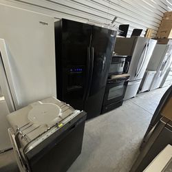 Black appliances, refrigerator, stove, microwave dishwasher