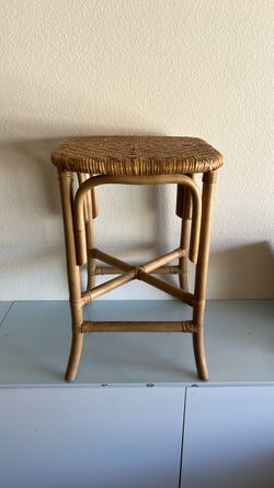 Two backless rattan barstools