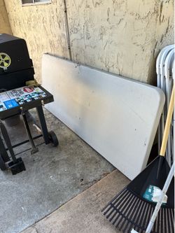 3 tables and 20 white folding plastic chairs