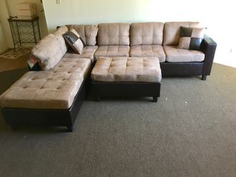 Brand new tan sectional +ottoman. The chaise is reversible