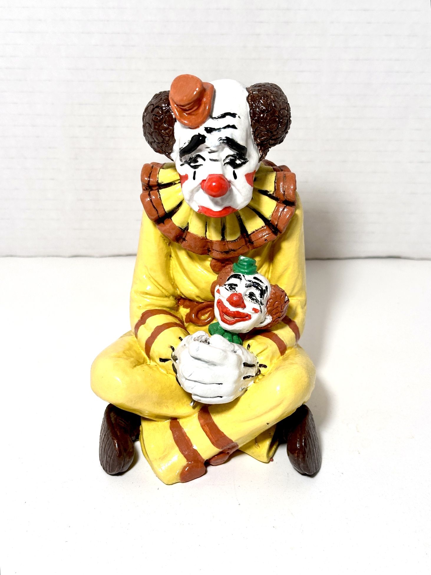 Vintage Sad Clown Holding Clown Doll Head Ceramic Figurine