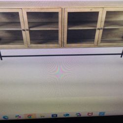 TV STAND FOR UP TO 85 INCH HIGH END MERCANA ARELIUS… 70X18X32H LIGHT TAN WOOD…MISSING TWO SIDE GLASSES NO BIG DEAL..  RETAILS AT 1595 PLUS TAX NEW  IN