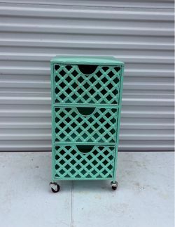 12”x12”x24” aqua turquoise accent cabinet features a three-drawer design with a distinct Moroccan-style lattice fretwork pattern.