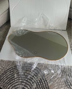 Gold irregular shaped mirror