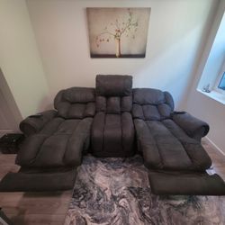 Green/Gray suede memory foam filled dual reclining couch.