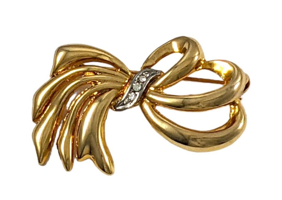 SWAROVSKI CRYSTAL GOLD TONE BOW BROOCH