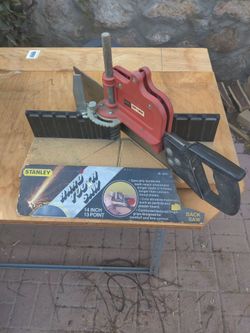 Miter box with saw