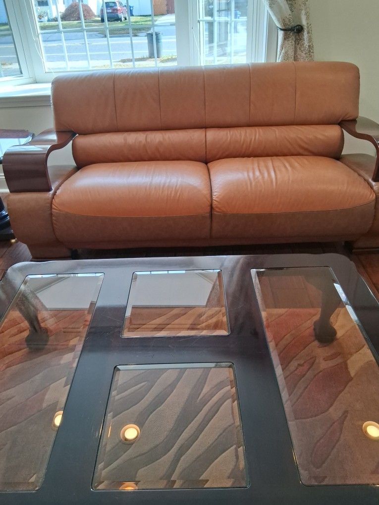 Three pieces furniture couches loveseat and chair and  coffee table
