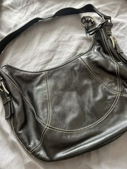 Black leather Michael khor Hand bag 