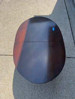 Oval drop-leaf table
