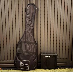 Black and white electric guitar with amplifier.