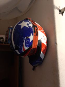 Motorcycle helmet wall hanger