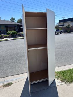 Tall cabinet, good cond — FREE