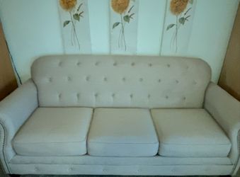 Beautiful beige couch with copper buttons