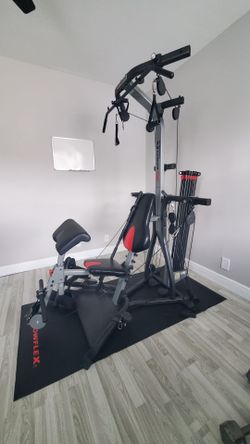 Bowflex Xtreme 2 SE home gym w/ poster