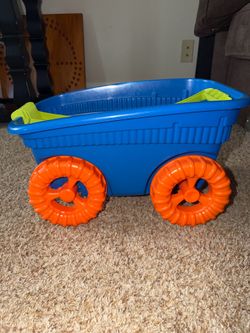 American Plastic Toys Wagon featuring bright orange wheels and green handle