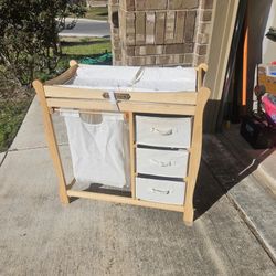 Changing table with drawers and laundry basket