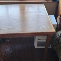 Wood Table in Nice Shape 33" X 33" has  Extensions On Both Ends Adds 12" To Both Ends. $20 OBO.