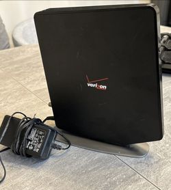 Verizon FIOS G1100 Wireless Router with power supply and stand  The Verizon/Frontier FIOS G1100 Wireless Router is a high-performance device