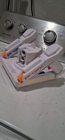 ProjecX image Projecting Arcade game console equipped with 2 wired laser blasters. Good working condition. it comes with 2 different images.