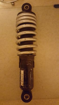 Shock; I believe this came off an Artic Cat DVX50 but should fit several 50cc quads like polaris