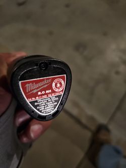 Milwaukee saw and 3 small bateries