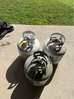 3 empty propane tanks 10 dollars each