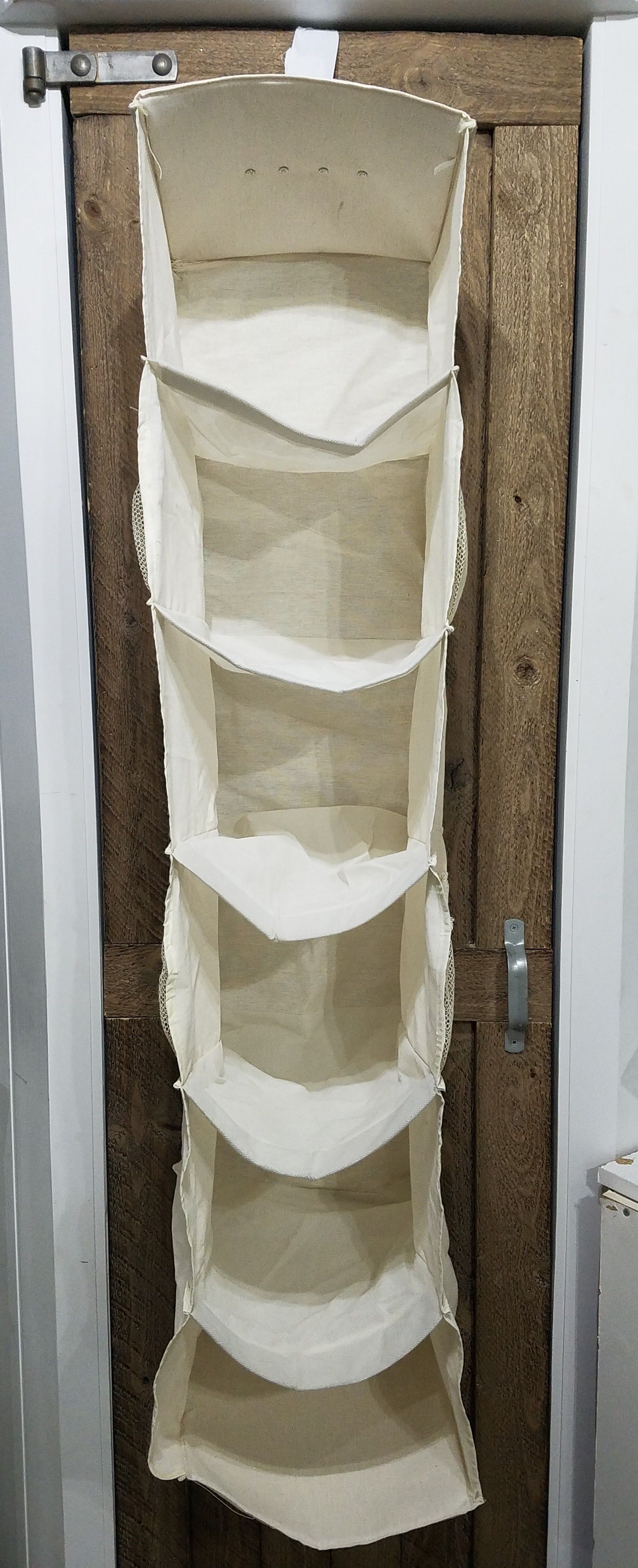 Hanging closet shelf organizer