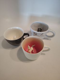 3 cups with animal figures inside