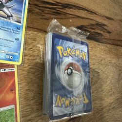 Pokemon Cards And One Unopened Pack 