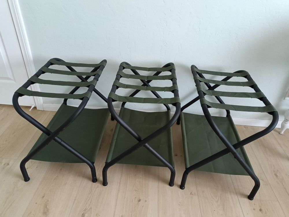 Three Songmics Luggage Racks