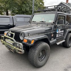 2002 Jeep Wrangler Sierra 4.0 5-speed ENGINE TICKS LEAK