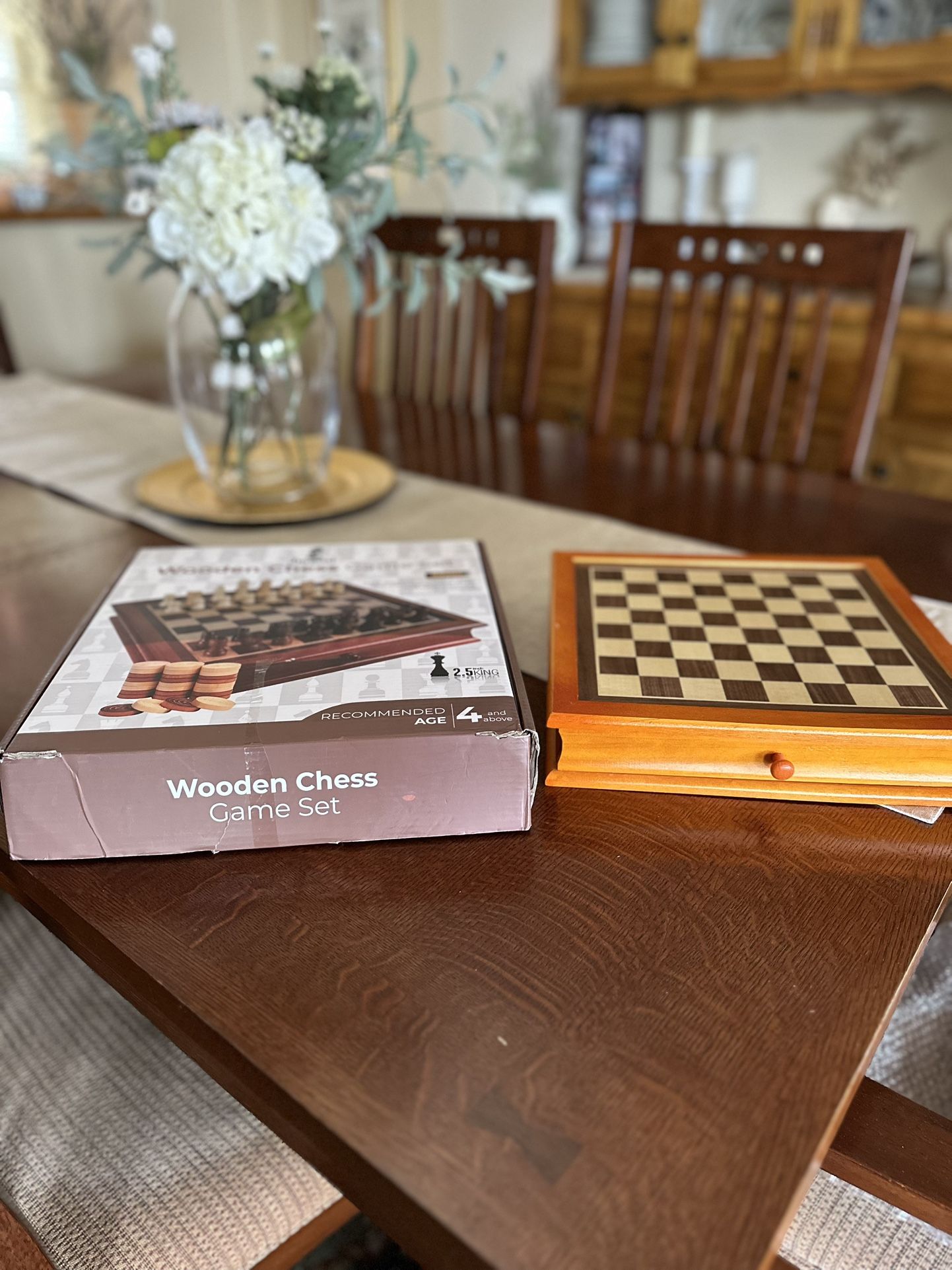 Wooden chest and checker set with storage drawer
