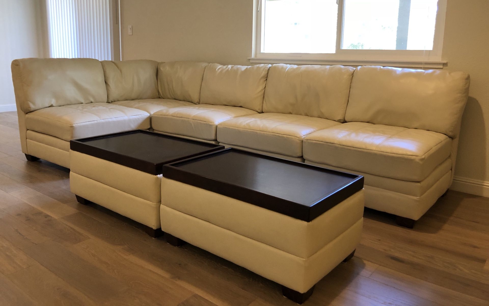 Modern white leather sectional/couch with coffee table