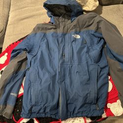 The North Face Summit Series blue and grey jacket