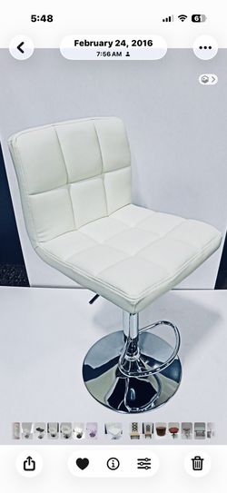 White tufted bar chairs