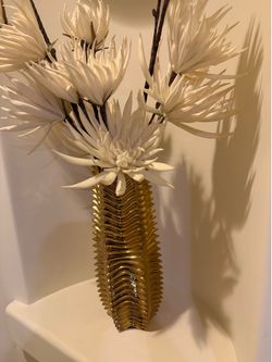 Large gold vase with flowers