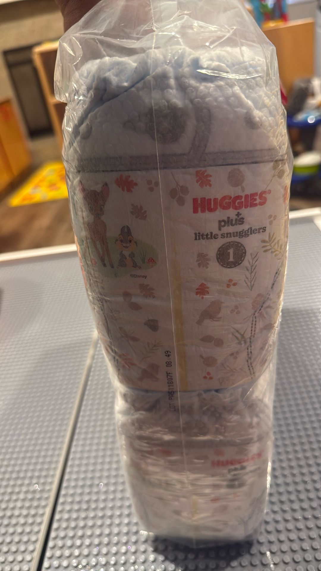 64 HUGGIES DIAPERS
