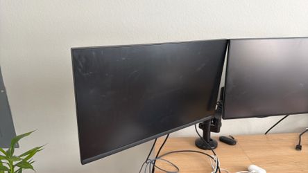 Two Dell monitors and Stand