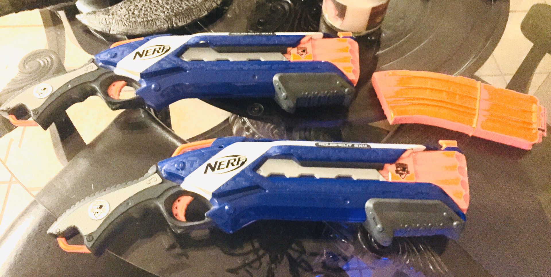 Rough-cut Nerf guns two of them plus an extra bullet pack